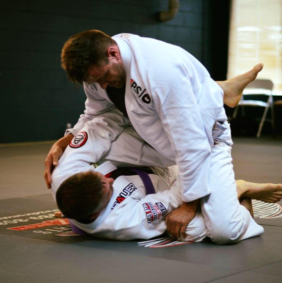 Two dedicated Jiu-Jitsu practitioners demonstrating techniques for our online video training academy
